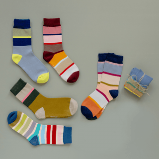 Colorful striped socks on a gray background
